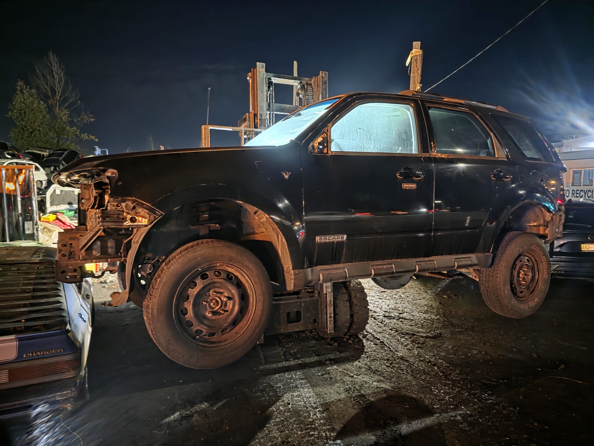 Non-running car being removed from Collingwood, Vancouver
